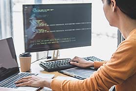 Lady working on software code