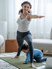 mom-yoga-with-child-playing